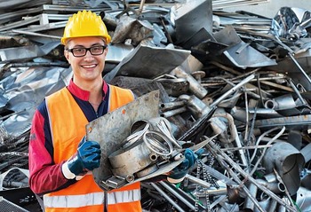 Smiling Worker in Metal Landfill
